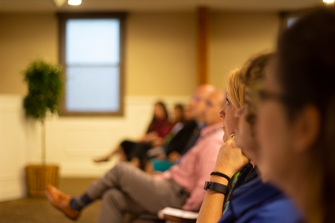 People gathered in a supportive group setting
